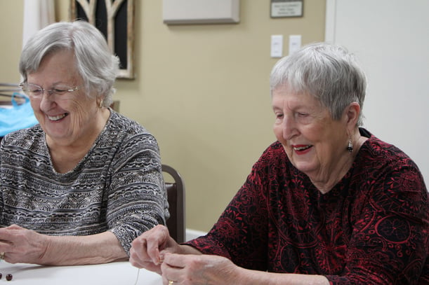 2 residents doing crafts