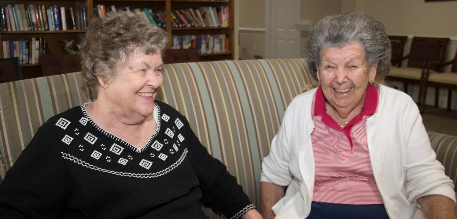 two women laughing residents